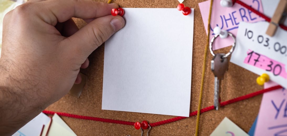 Conspiracy theory board with red string linking pieces of evidence