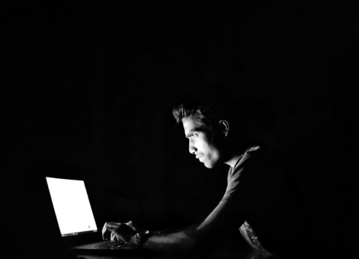 A man sitting at a computer