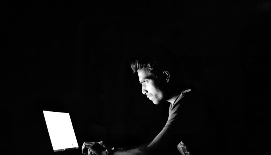 A man sitting at a computer